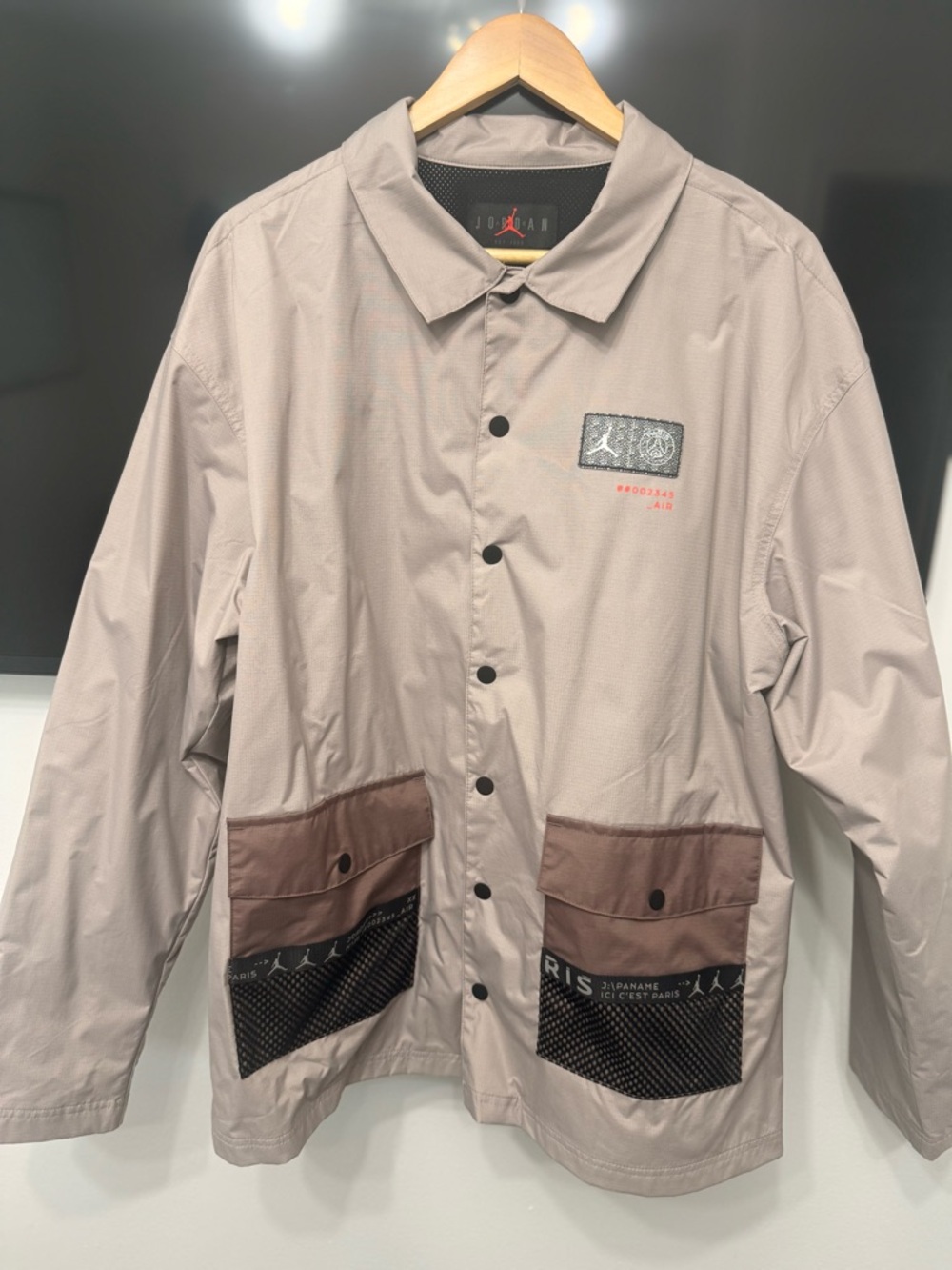Jordan x Paris Saint-Germain Light Taupe Coach Jacket with Brown Pocket Panels